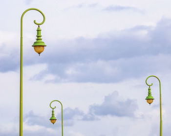 Low angle view of street light against sky