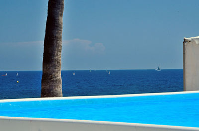 Scenic view of sea against blue sky