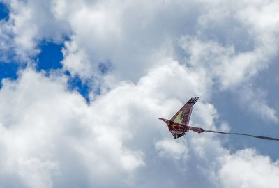 Low angle view of airplane flying in sky