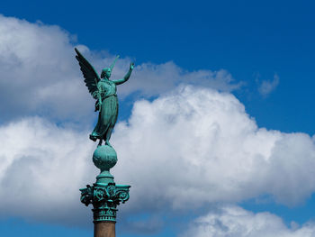 Ivar huitfeldt column against cloudy sky