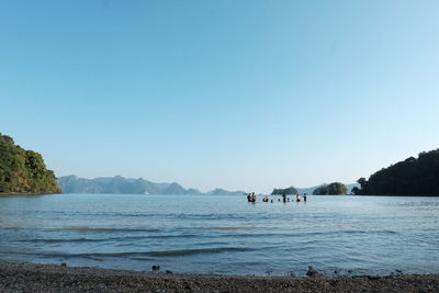 Scenic view of sea against clear blue sky