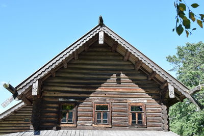 Low angle view of building against clear blue sky