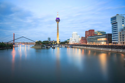 View of bridge and buildings against sky