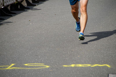 Low section of man running in sports race