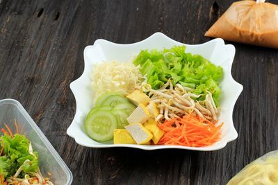 Asinan betawi. indonesian raw vegetable and yellow tofu bean curd with tangy peanut dressing 