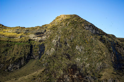 Low angle view of mountain against clear sky