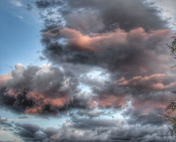 Low angle view of dramatic sky during sunset