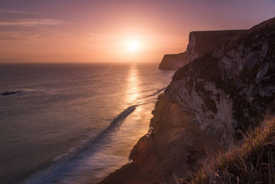 Scenic view of sea against sky during sunset