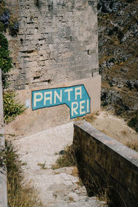 Road sign by water