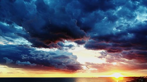 Scenic view of dramatic sky over sea