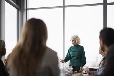 Woman talking during business meeting