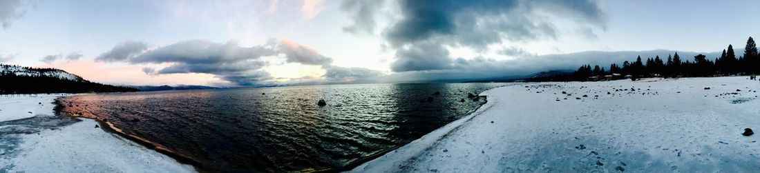 Scenic view of sea against cloudy sky