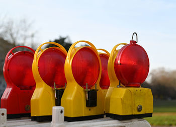 High angle view of multi colored warning lights against blue background