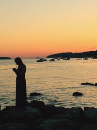 Scenic view of sea at sunset