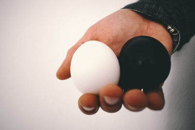 Close-up of human hand against white background