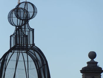 Low angle view of sculpture against clear sky