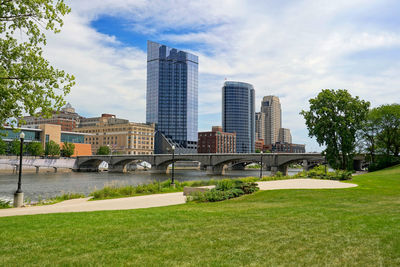 Buildings in park against sky