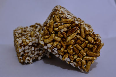 Close-up of burger against white background