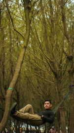 Full length of young man in forest