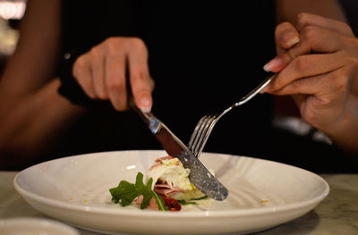 Midsection of man preparing food