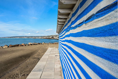 Scenic view of beach against blue sky