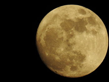 Low angle view of moon against sky at night