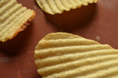 Close-up of potato chips on table