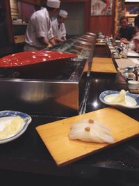 High angle view of man preparing food on table