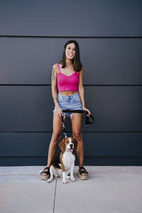 Portrait of young woman with dog