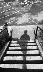 Shadow of people on road