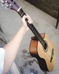 High angle view of man playing guitar