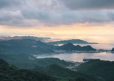 High angle view of bay against sky at sunset