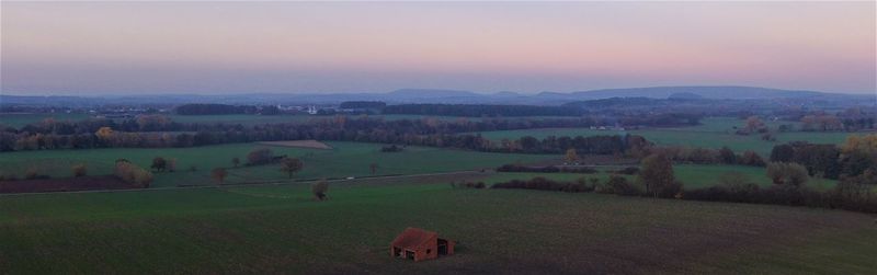 Scenic view of landscape against sky during sunset