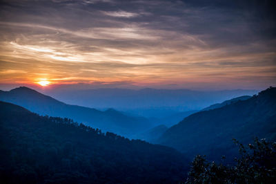 Scenic view of mountains against sky during sunset