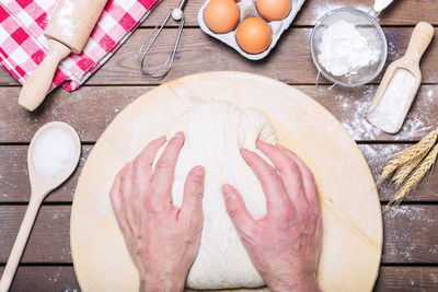 High angle view of person preparing food on table