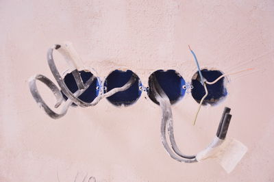 High angle view of shoes hanging on wall