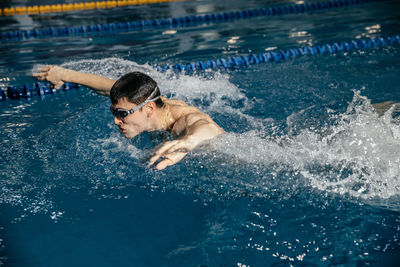 High angle view of man swimming in pool