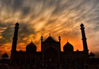 Group of people in temple during sunset