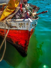 Cropped image of boat moored at lake