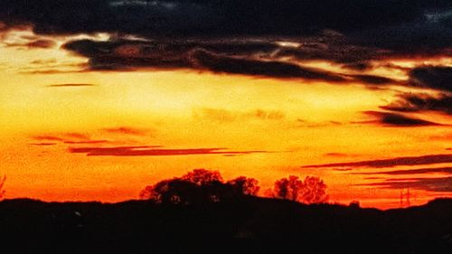 Low angle view of dramatic sky during sunset