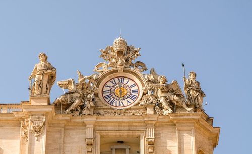 Low angle view of statues on building