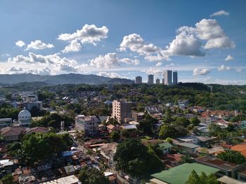 High angle view of trees and buildings against sky