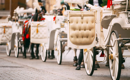 Rear view of man riding motor scooter on street