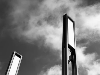 Low angle view of communications tower against sky
