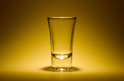 Close-up of beer in glass against black background