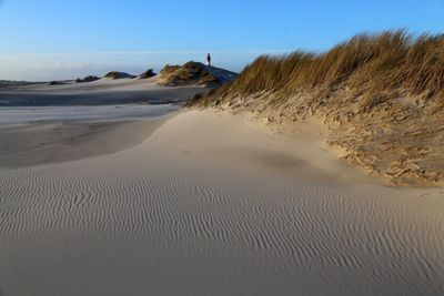 Scenic view of beach against clear sky