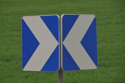 Close-up of umbrella on field