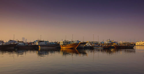 Boats moored at harbor