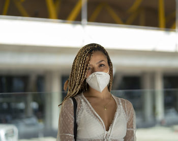 Portrait of a tourist at the airport with the mask