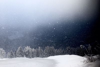 Snow covered landscape against sky